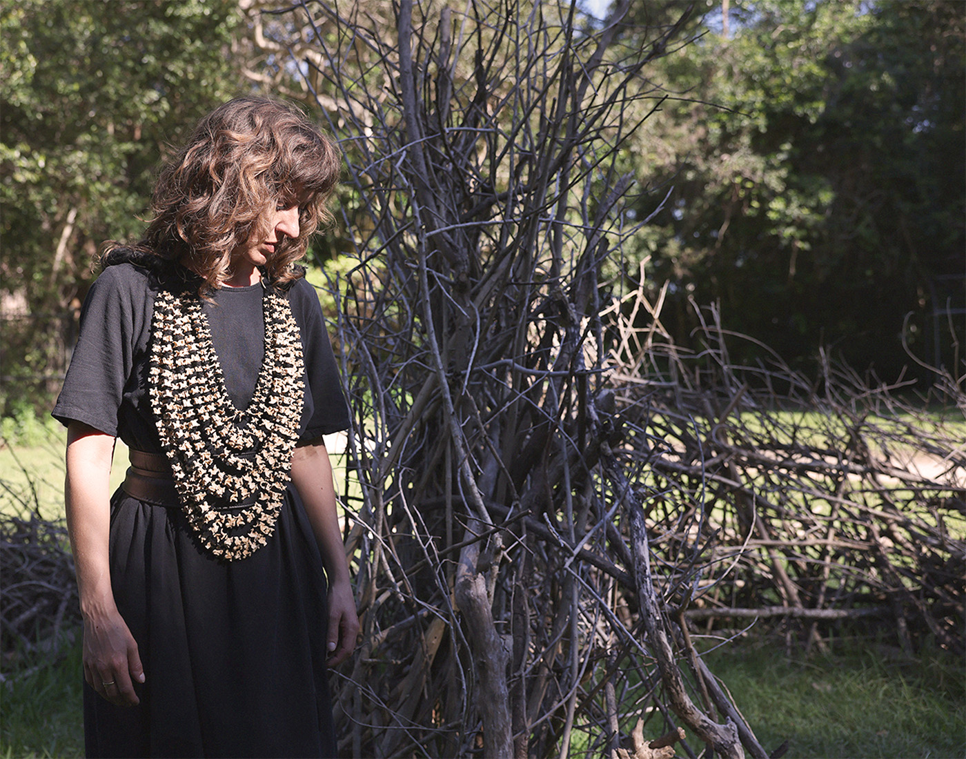 Artist Rebecca White wearing the breastplate in a performance.
