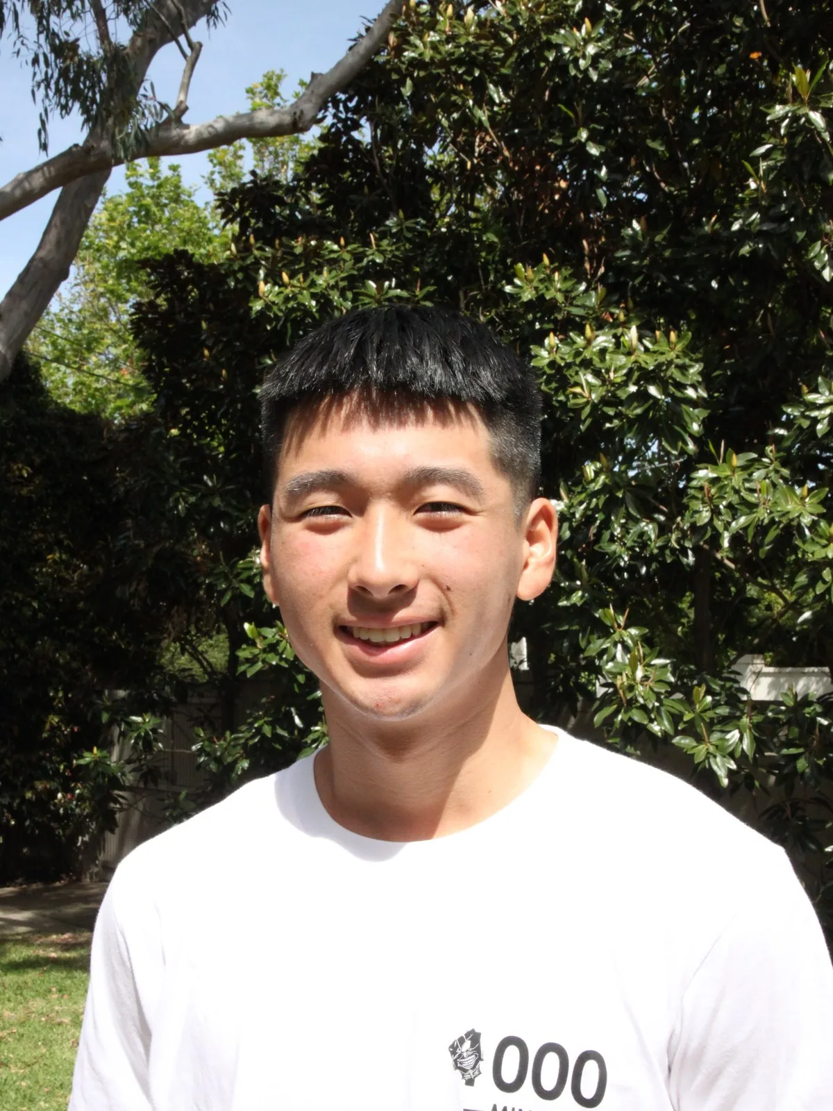 Senior student outside on a sunny afternoon