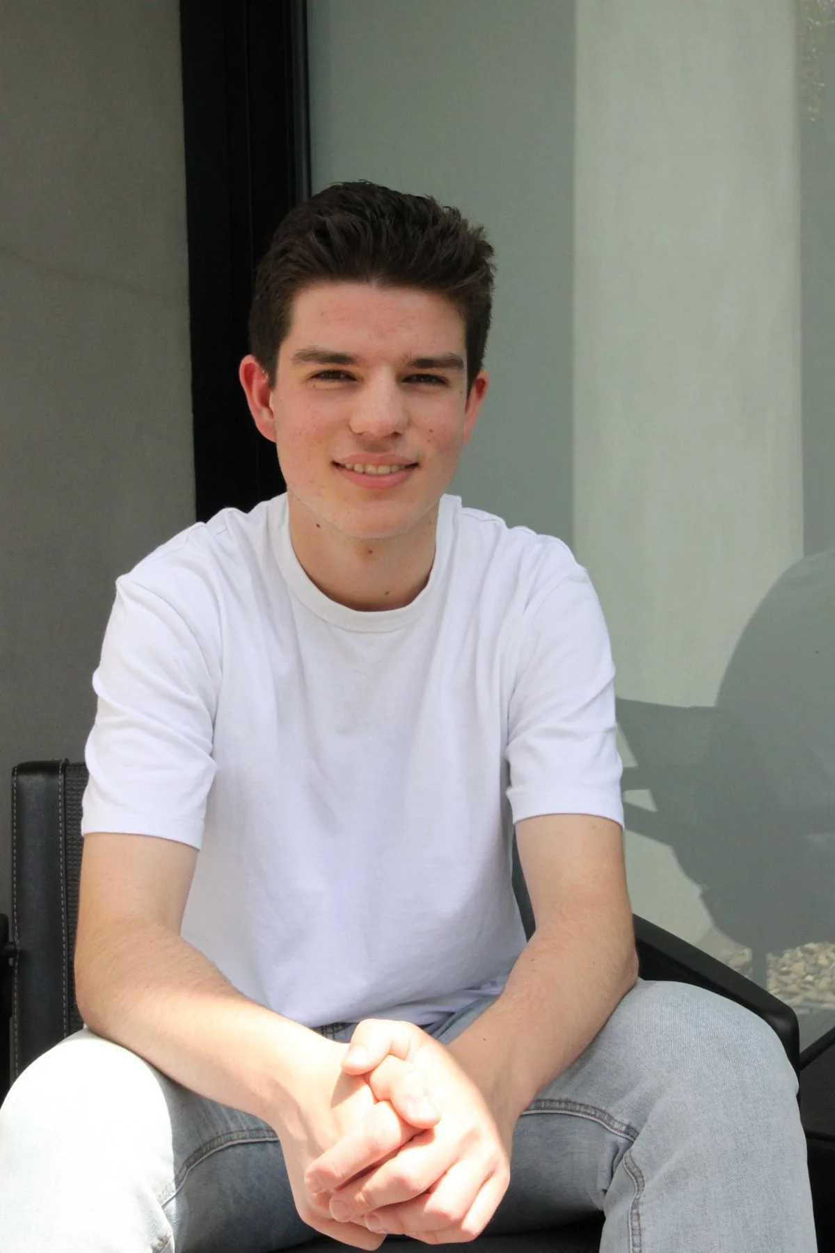 Senior student smiling in his study