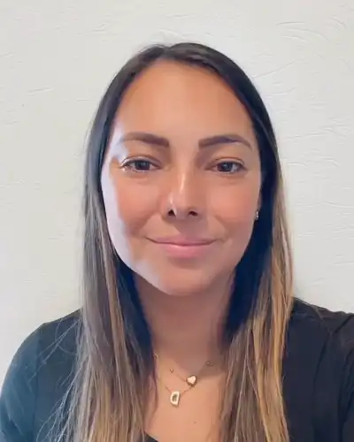 Dani, Tutero account manager, waving
