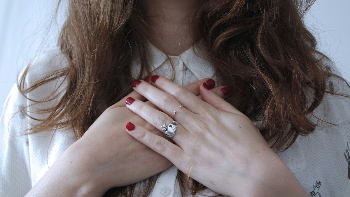 A person with their hands crossed over their chest.