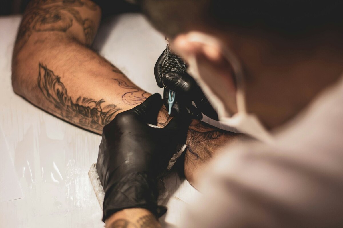A person getting tattooed.