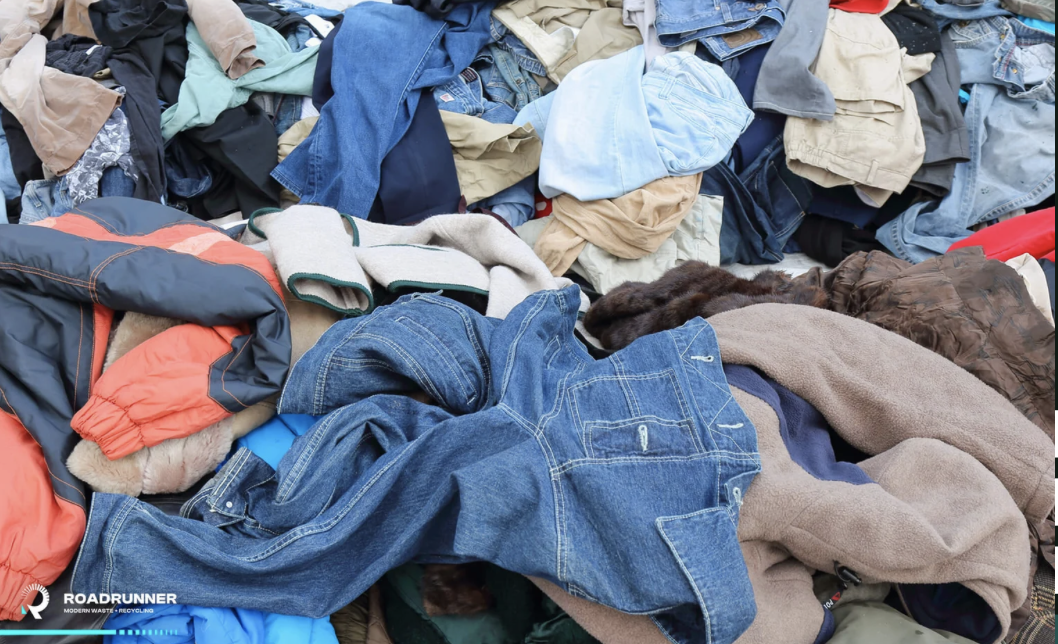 sustainable womens clothing can help cut down on textile waste like the piles of discarded clothes pictured here 