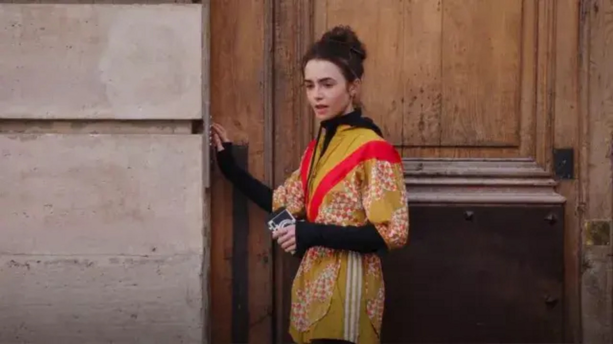 “Emily in Paris” protagonist Emily Cooper in a yellow bodysuit.