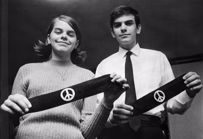 protestors showing off their political arm bands in the 60s