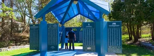 Father and son standing in a Great Trail pavilion in Caledon East
