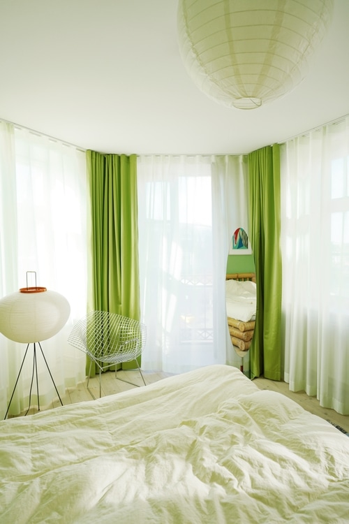 Green curtains from Arne Aksel shown in Marie Jedig's Apartment