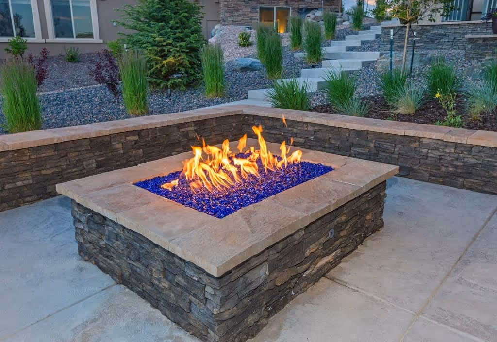 flagstone fire pit in the backyard