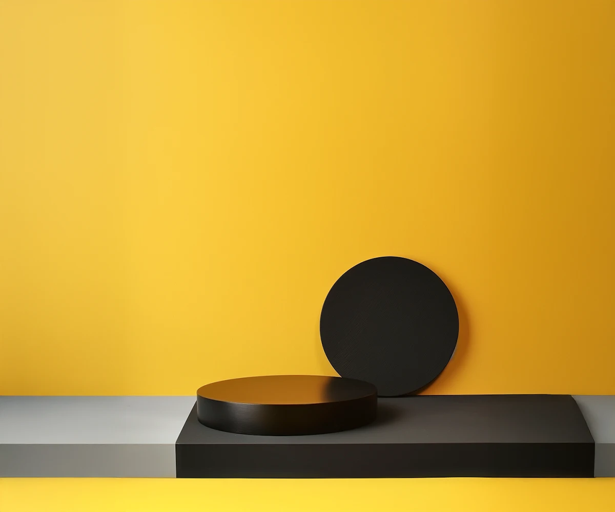 Minimalist black circular podiums on a two-tone gray and black rectangular base against a yellow background.