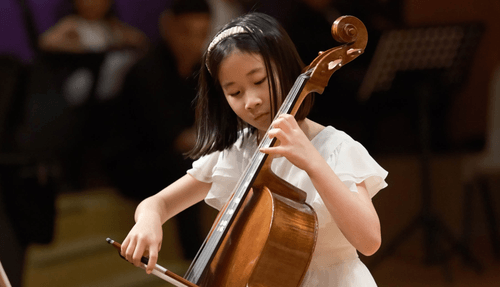 Children playing the cello.