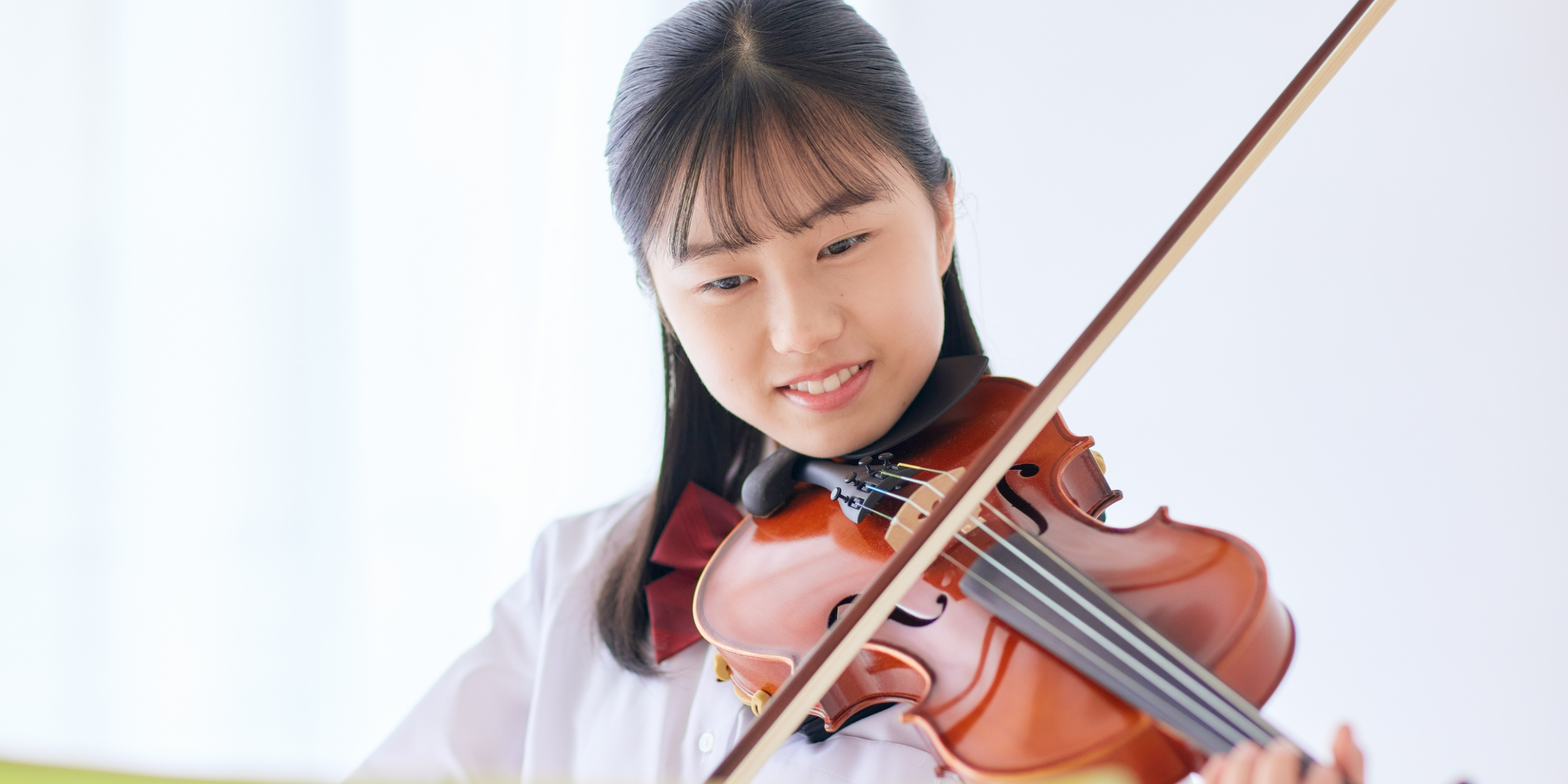 A child playing the viola