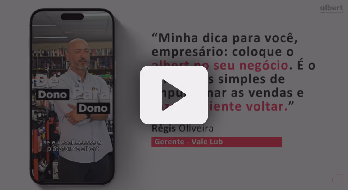 Video still showing a man crossing his arms in a store inside a phone frame on the left with Portuguese text on the right recommending 'albert' for businesses to increase sales and customer return, attributed to Régis Oliveira, manager at Vale Lub.