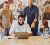 Careers team in front of computer