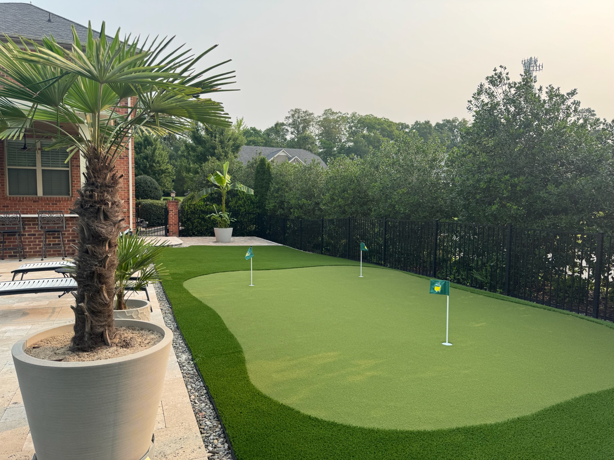 Custom backyard putting green installed by James River Nurseries in Richmond VA