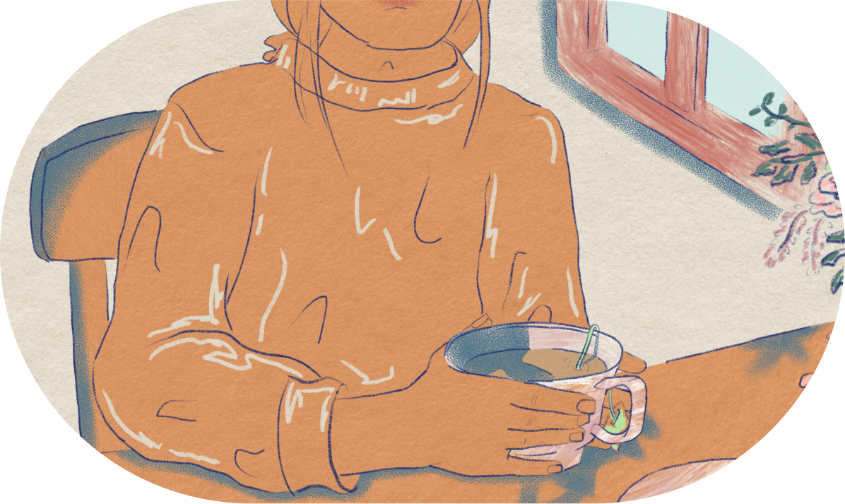 A woman holding a cup of tea, sitting in serenity