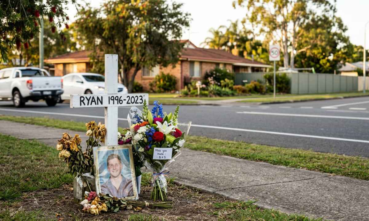 Roadside memorial cross for Ryan, 1996–2023, on a suburban Australian street with a 50km/h speed sign in the background