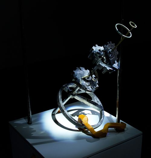 "Unknown Technology" Installation View, cast iron, steel, cast plastic, acrylic paint, light, 69" x 24" x 23" (Includes pedestal)
