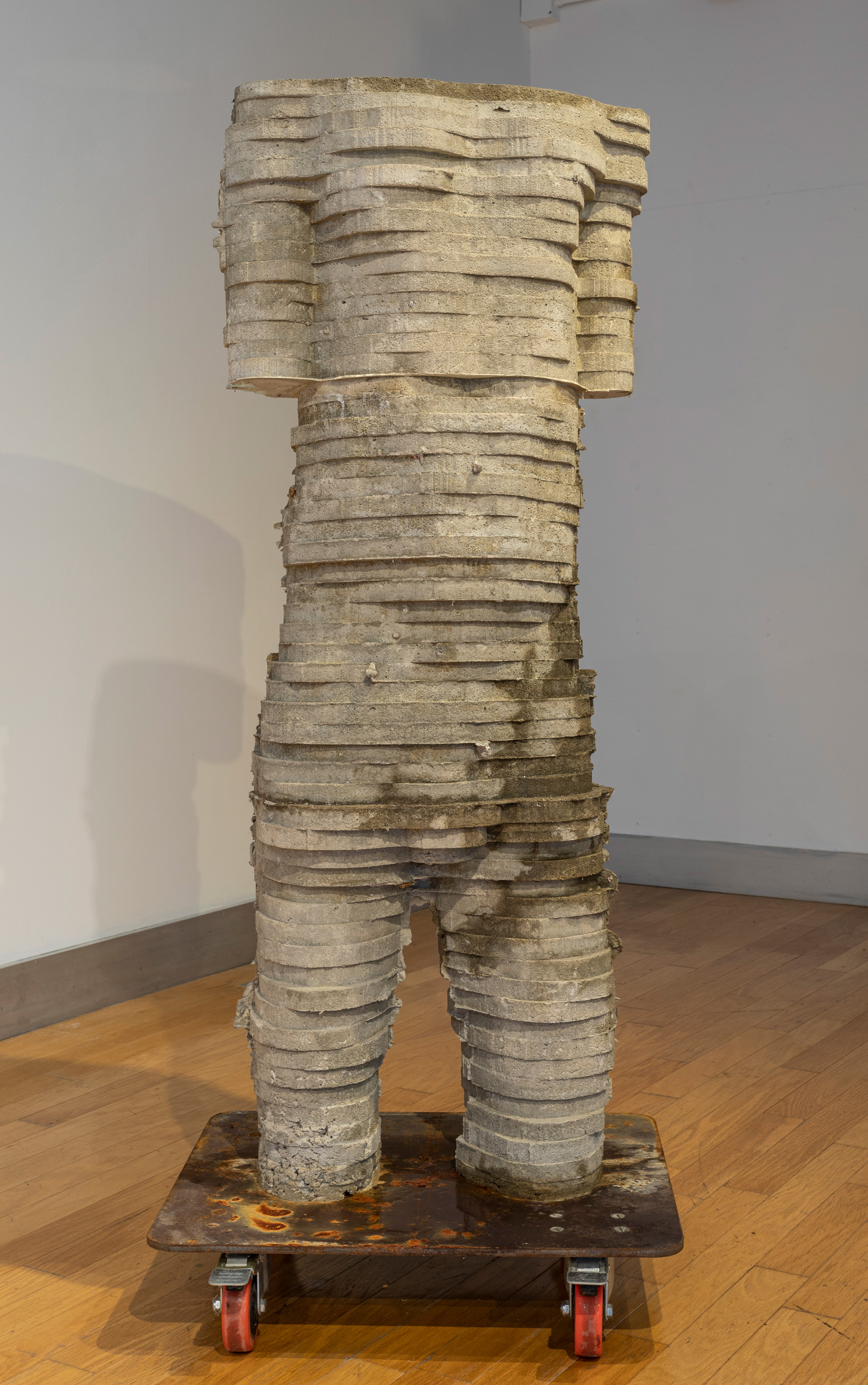 “Font” 2020, concrete, 60” x 28” x 16” Made from a digitally altered scan of my body. It is hollow and filled with water so that is continually “sweats” through the outer surface through small pinpricked size holes.