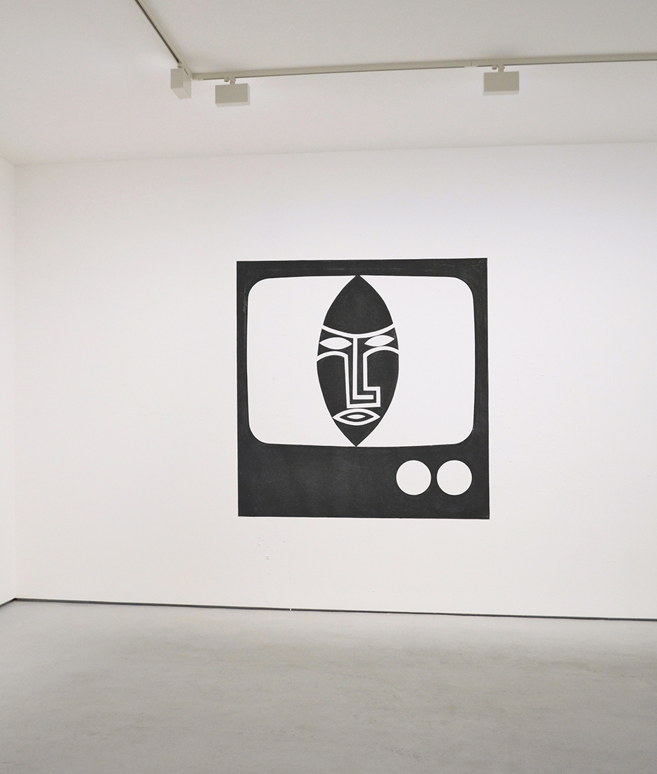 “TV/Mask” 2024, vinyl mounted on wall, room installation, approximately 72” x 70”