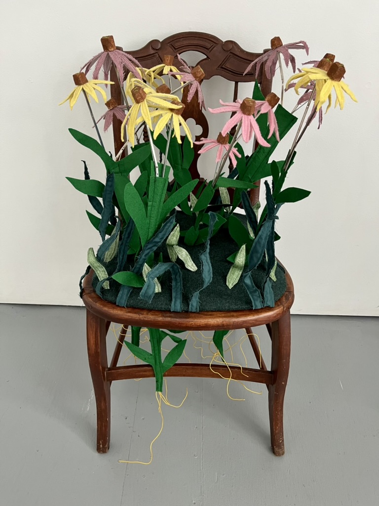 “Rooted” Repurposed merino, lambswool, cashmere, felted wool, vinyl, cotton, broken umbrellas, post-consumer plastic, cork, acrylic paint, embroidery thread, wire, and salvaged chair, 36" x 22" x 19"