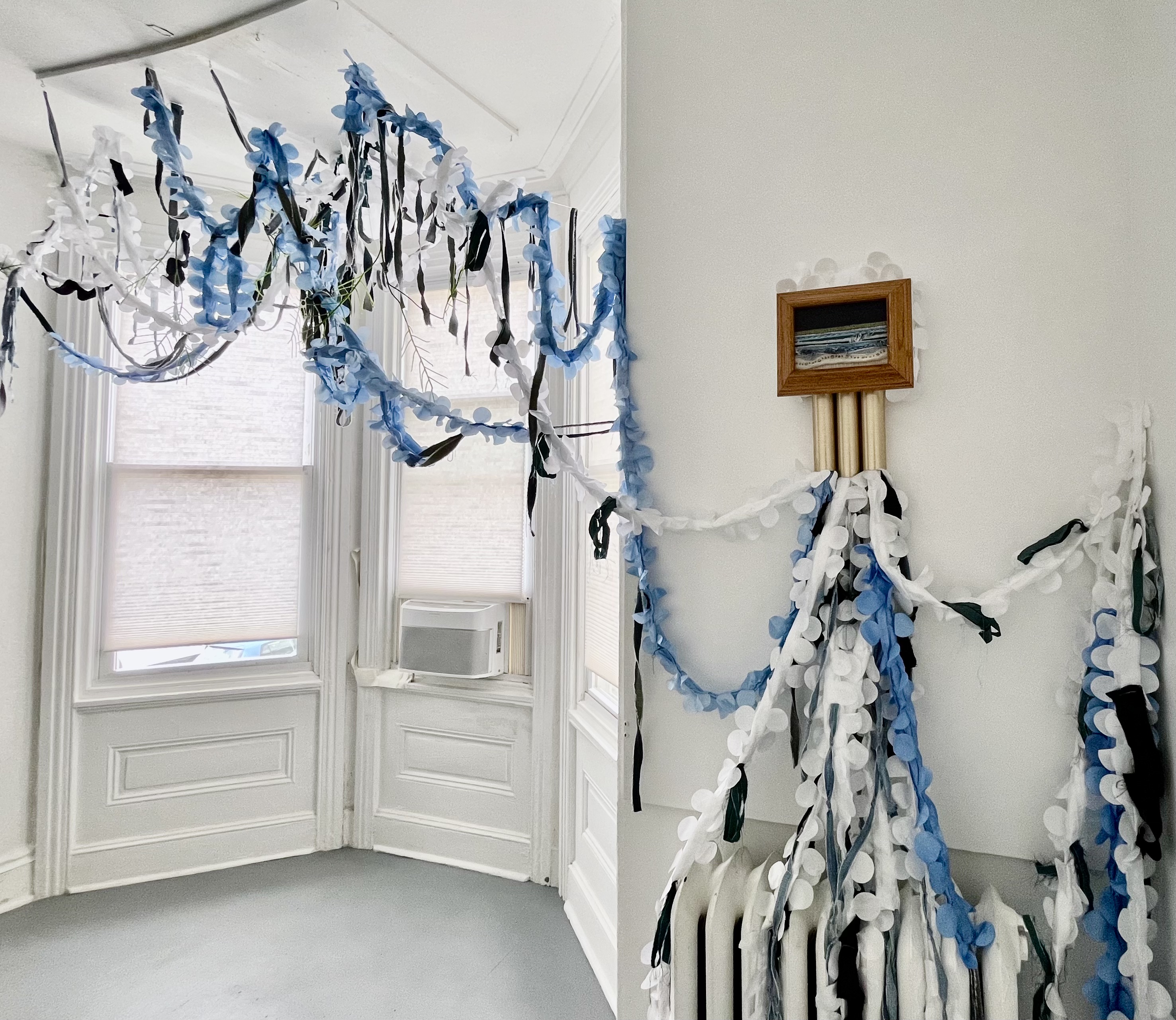 “Blue Crush” Repurposed cotton, silk, polyester, denim, upholstery blends, beads, sashiko thread, embroidery thread, oak, and salvaged doorbell, Variable dimensions