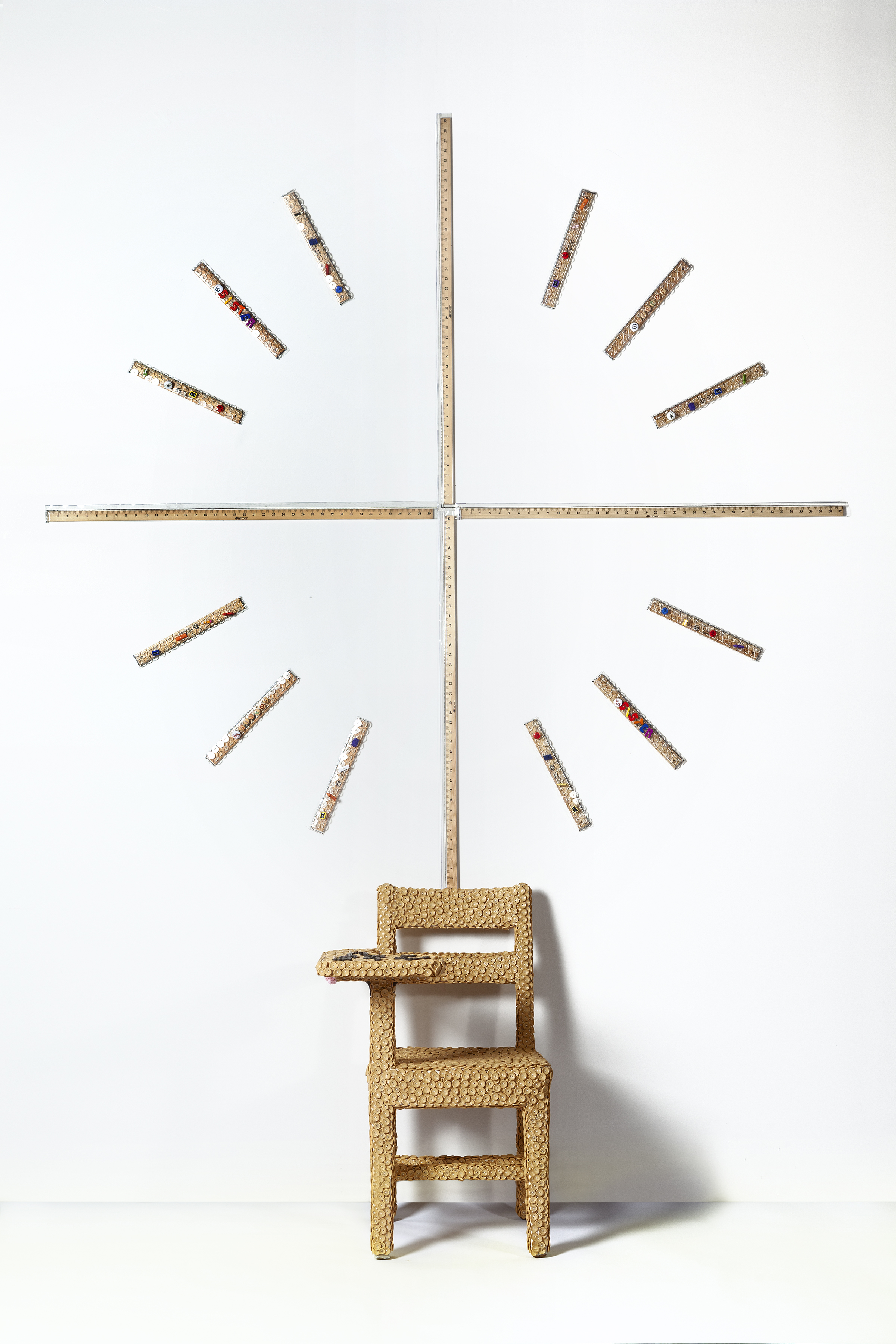 ABCDEFU, 2016, sculpture, polywood and plastic clothing buttons, embroidery thread, cotton fabric, wood chair, rulers, yardsticks, 34 x 22.5 x 24 in. (chair), 72 x 72 in (crosshair).