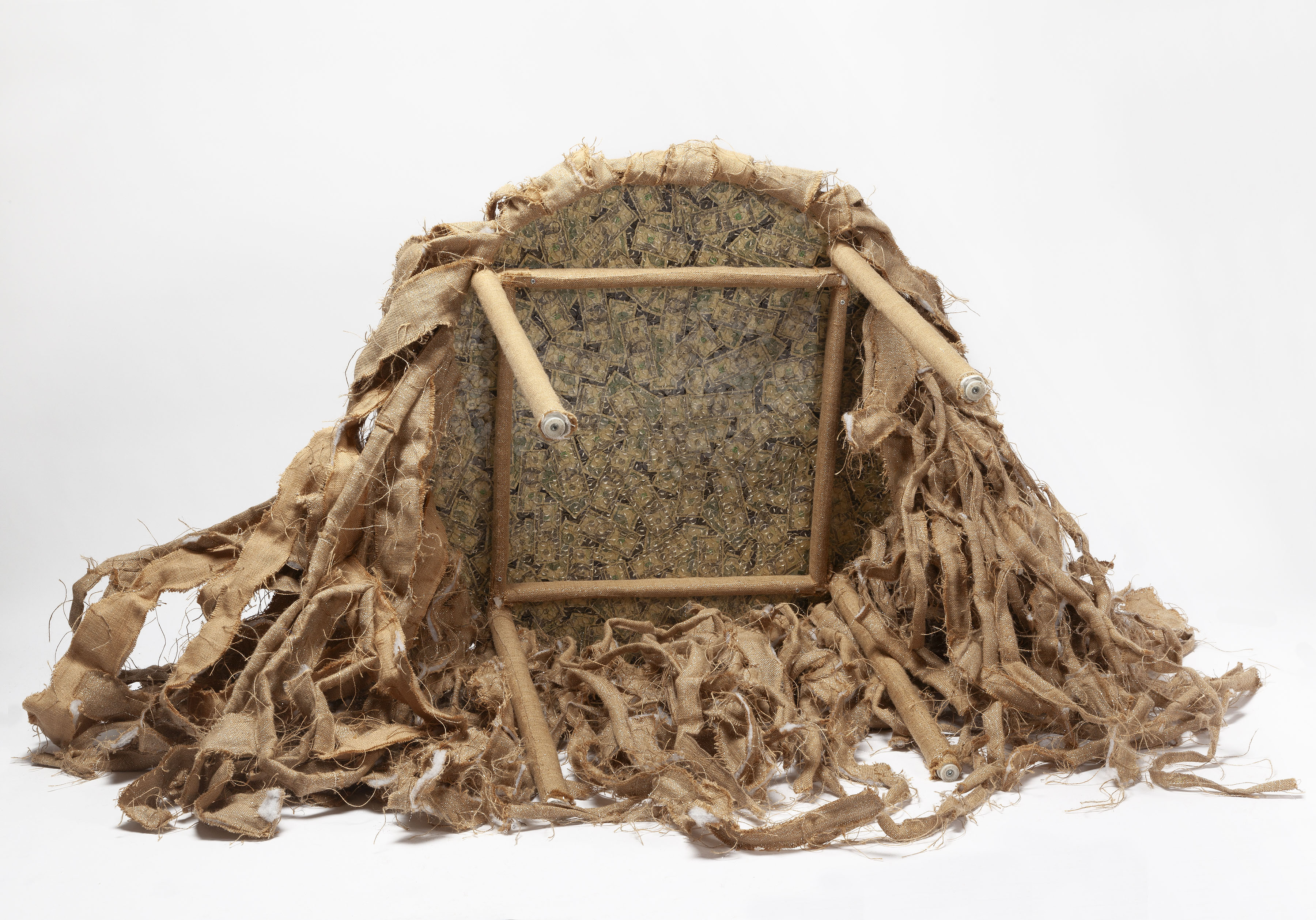 The Conversation, 2017-2023, sculpture, assorted clothing buttons (cloth, metal, bone, et al.), embroidery thread, burlap, plastic bags, 34 x 36 in. diameter (table) total dimensions variable UNDERSIDE VIEW
