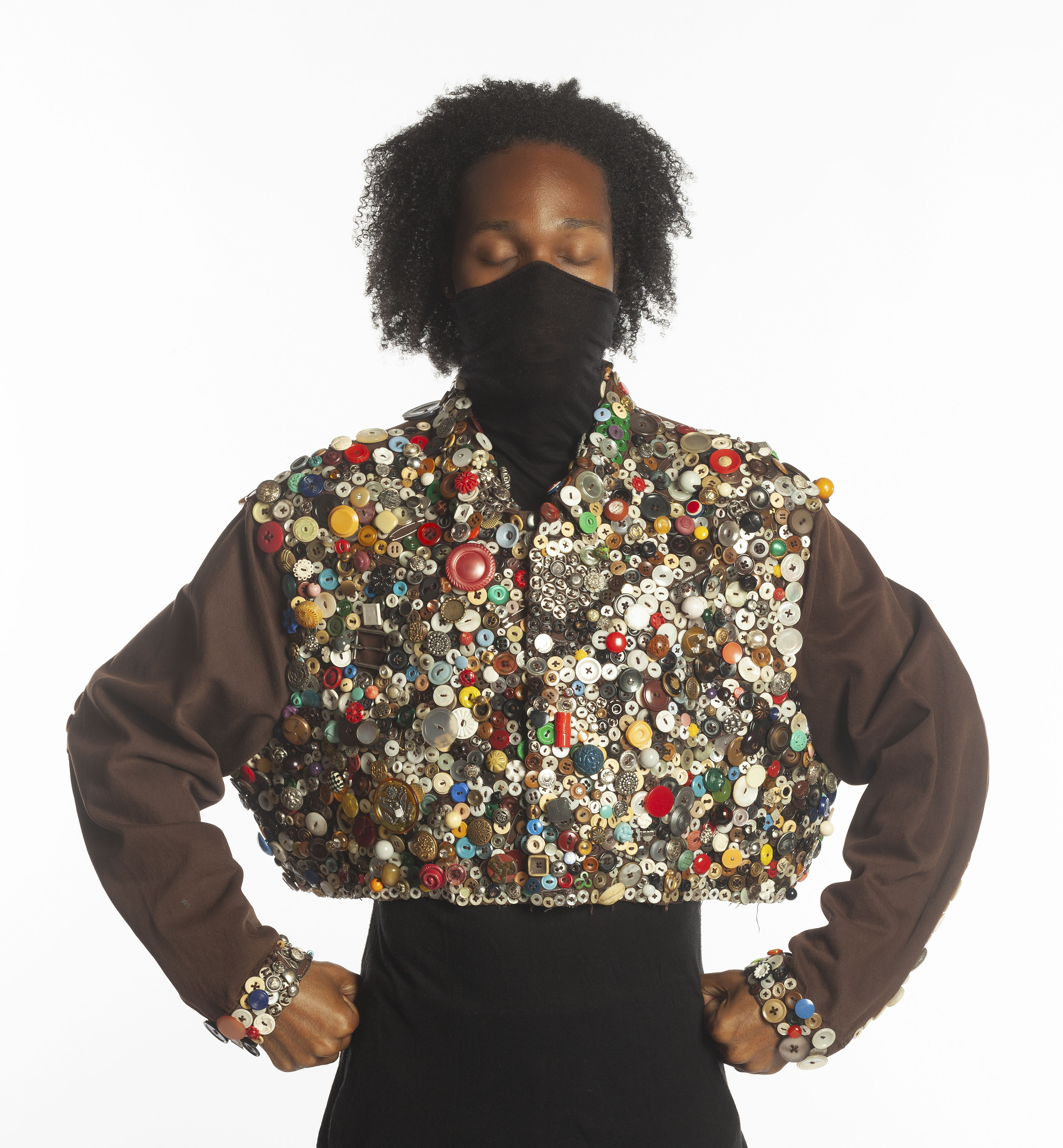 Button Bolero: Chocolate Sprinkles, circa 1990, wearable art, metal and plastic clothing buttons, embroidery thread, upcycled Levi’s denim jacket, 1 19.5 x 26.5 in.