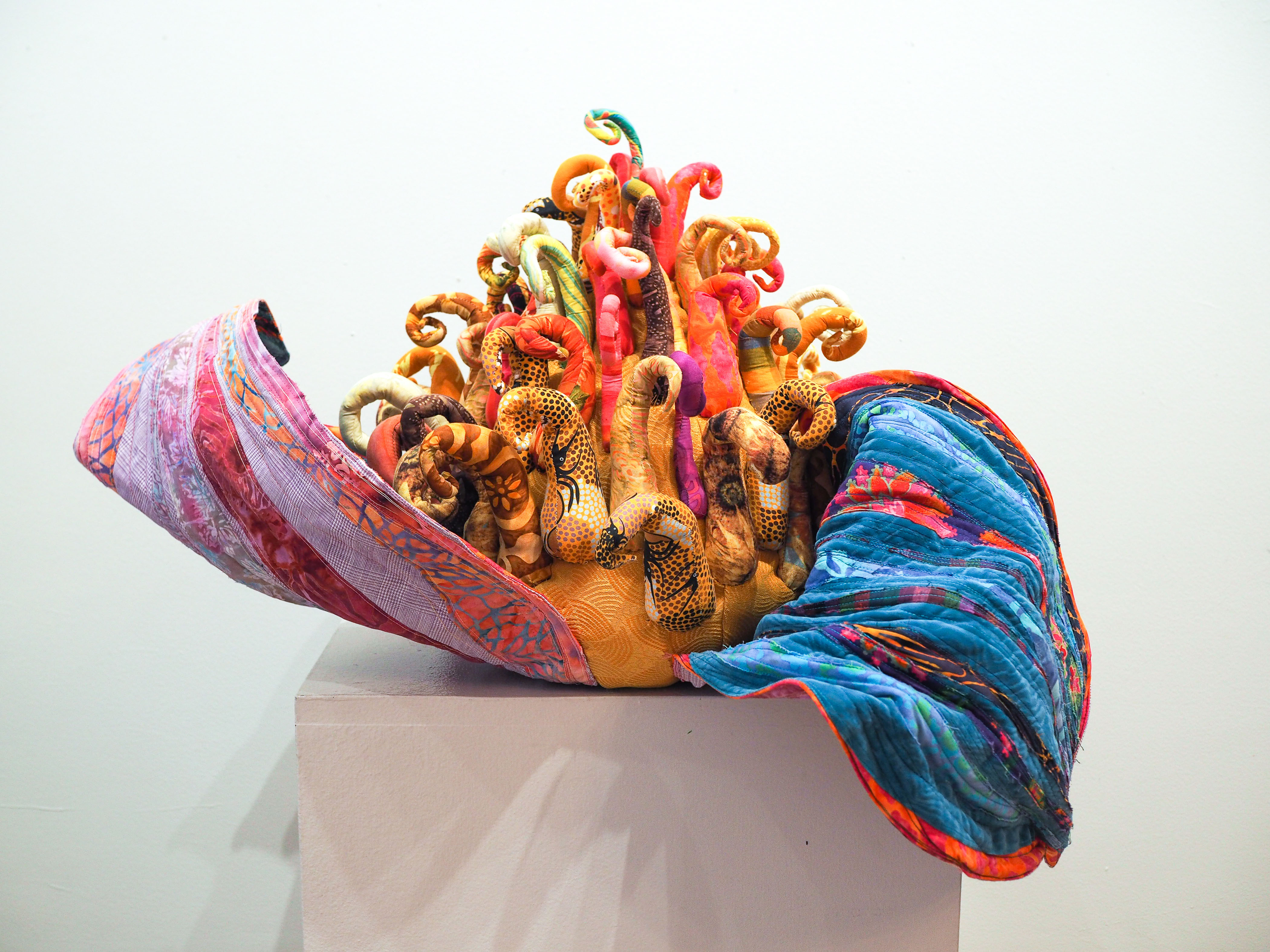 “Magnolia Grandiflora VI: Zelda the Flower” 2019, Machine quilted, machine raw edge appliqued, hand & machine constructed. Cotton & other textiles, aluminum wire, polyester stuffing, cotton batting, thread. 18” h x 36” w x 36” d