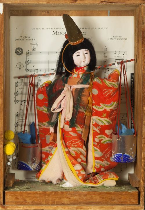 "Water Girl/Moon River" mixed media: antique Korean doll, antique wooden box, dried flowers, hat pins, sheet music, 12 ½" x 9" x 7 ¾"