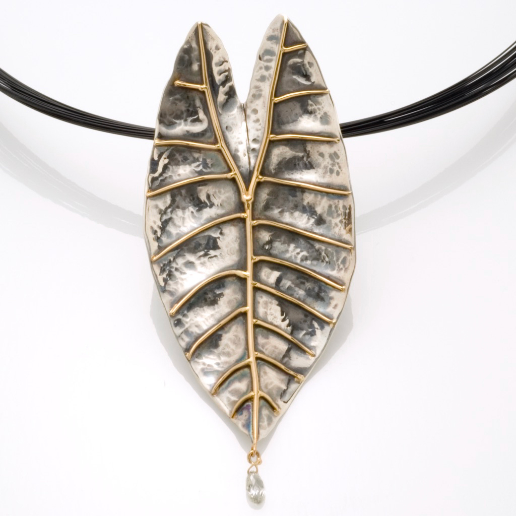 “Philodendron Leaf” pin/pendant:Hand forged Sterling Silver and 18k gold with diamond briolette.