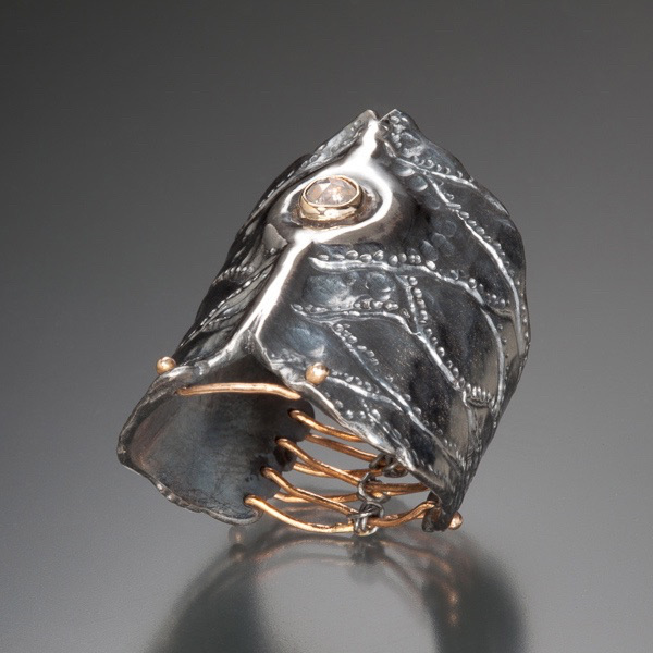 Untitled ring: Hand forged sterling silver and 14k gold ring set with a rose cut rough diamond.