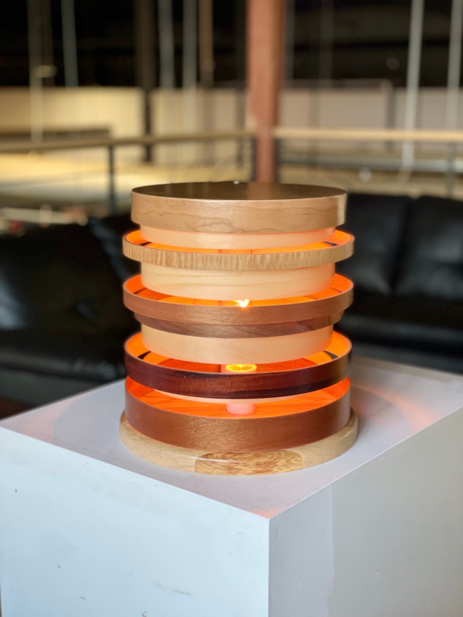 "Halo" 2025, wood drum shell fragments. LED fixture, solid hardwood laminate base, 15” x 15”