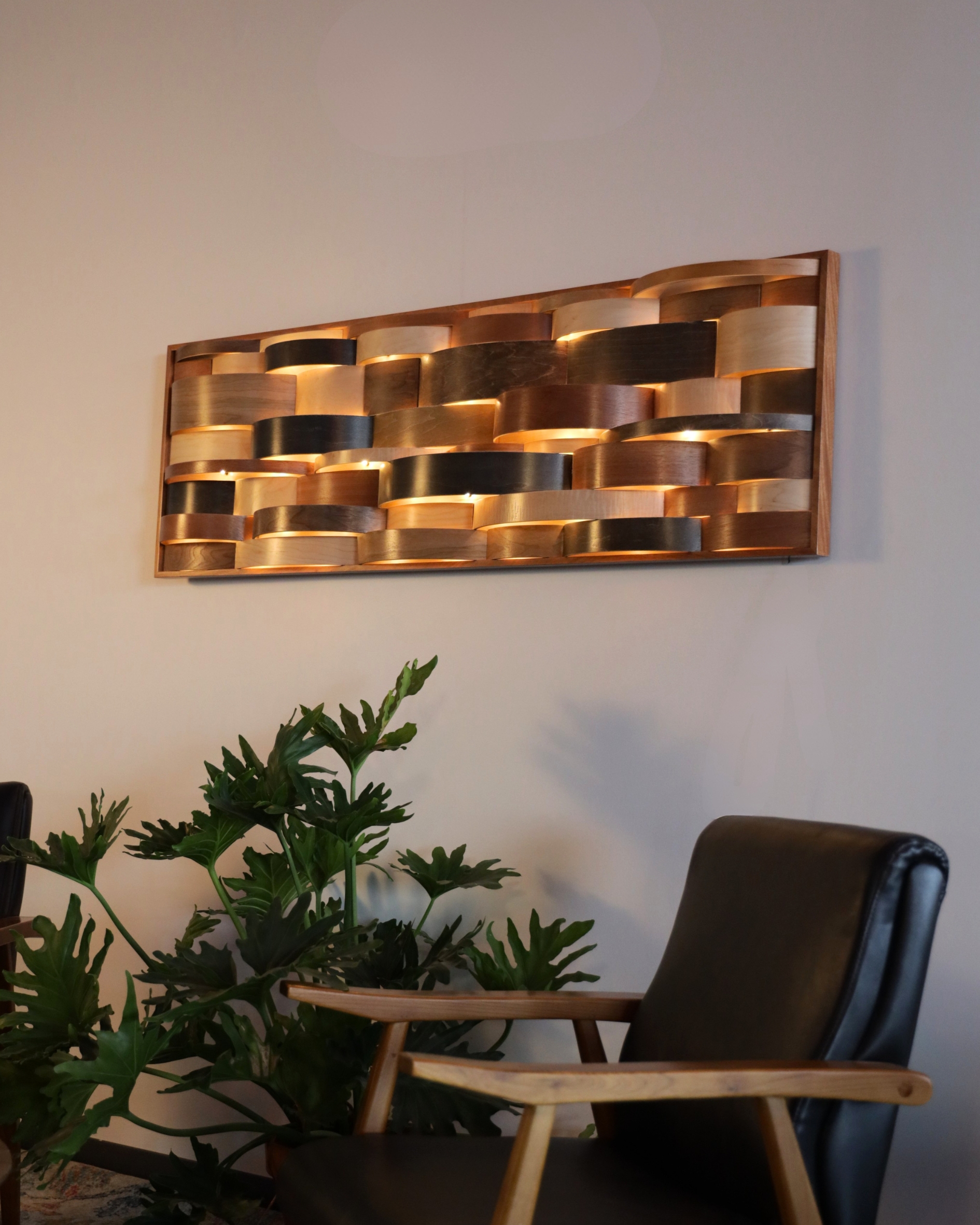 "Contour Glow" 2024, wood drum shell fragments, LED nodes, mahogany frame, 66” x 18”