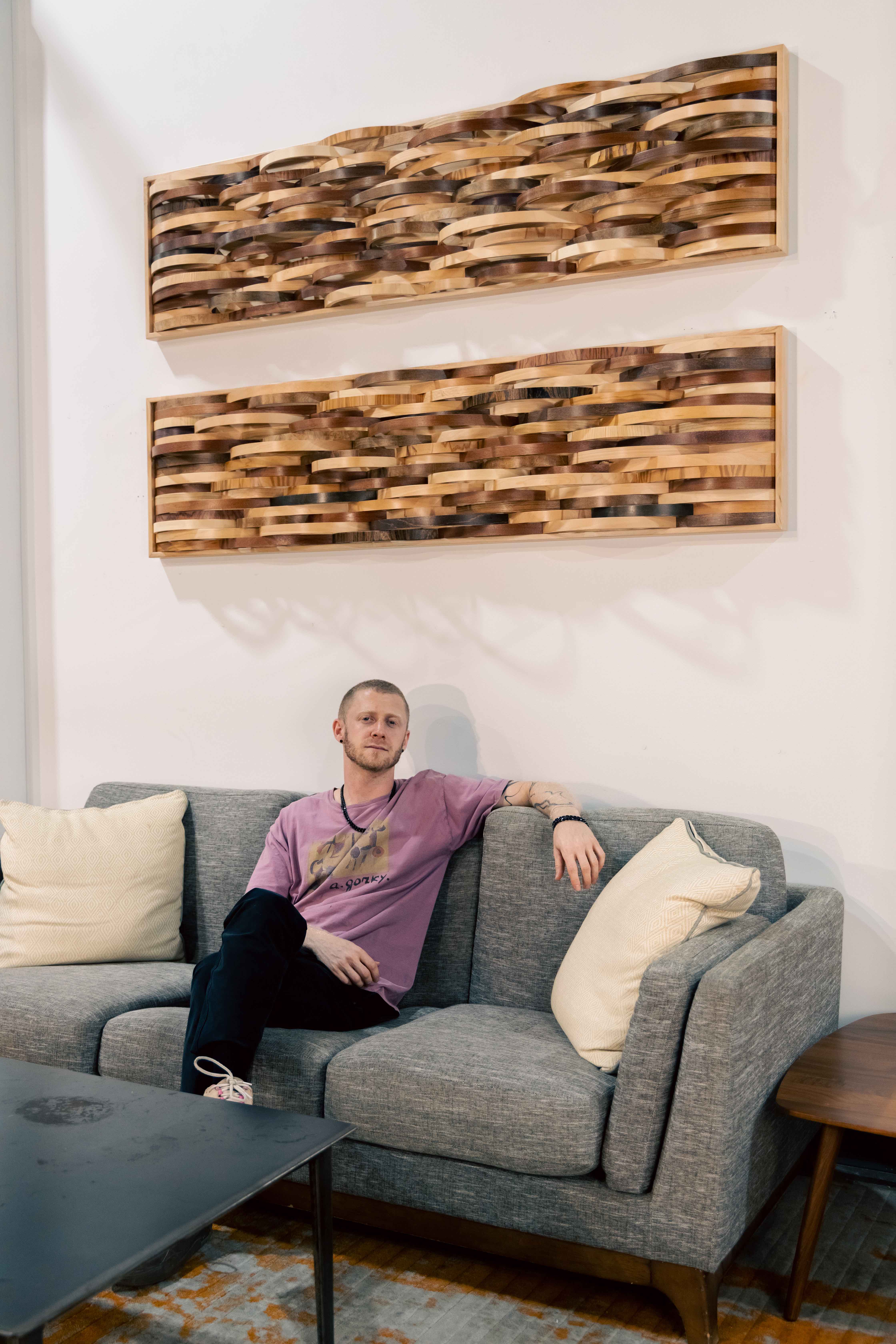 “entwine” 2026, spalted maple frame, mixed drum shell fragments, 17” x 69”