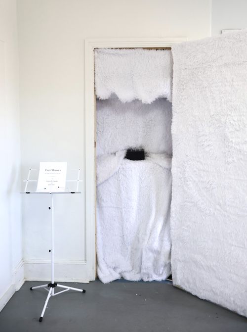"Fuzz Monster" Installation piece. Buttons on the black box trigger simultaneous pitch and light displays. Gallery visitors were able to create their own melodies. Created in collaboration with Tyler Lane.