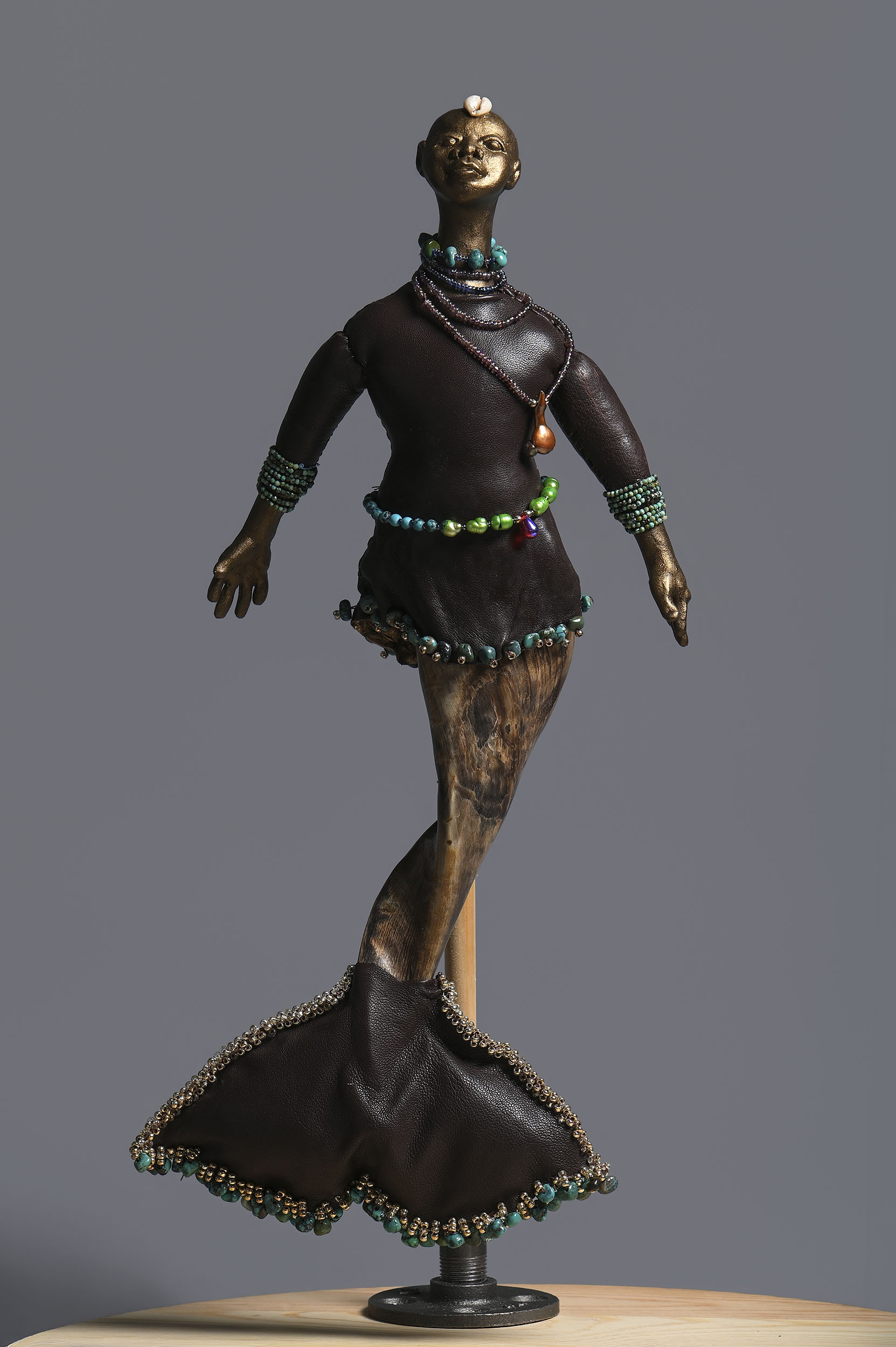 Njuzu | 2026, goat horn, paper clay, freshwater pearls, turquoise, 16 inches H