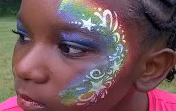 Child with detailed face painting design