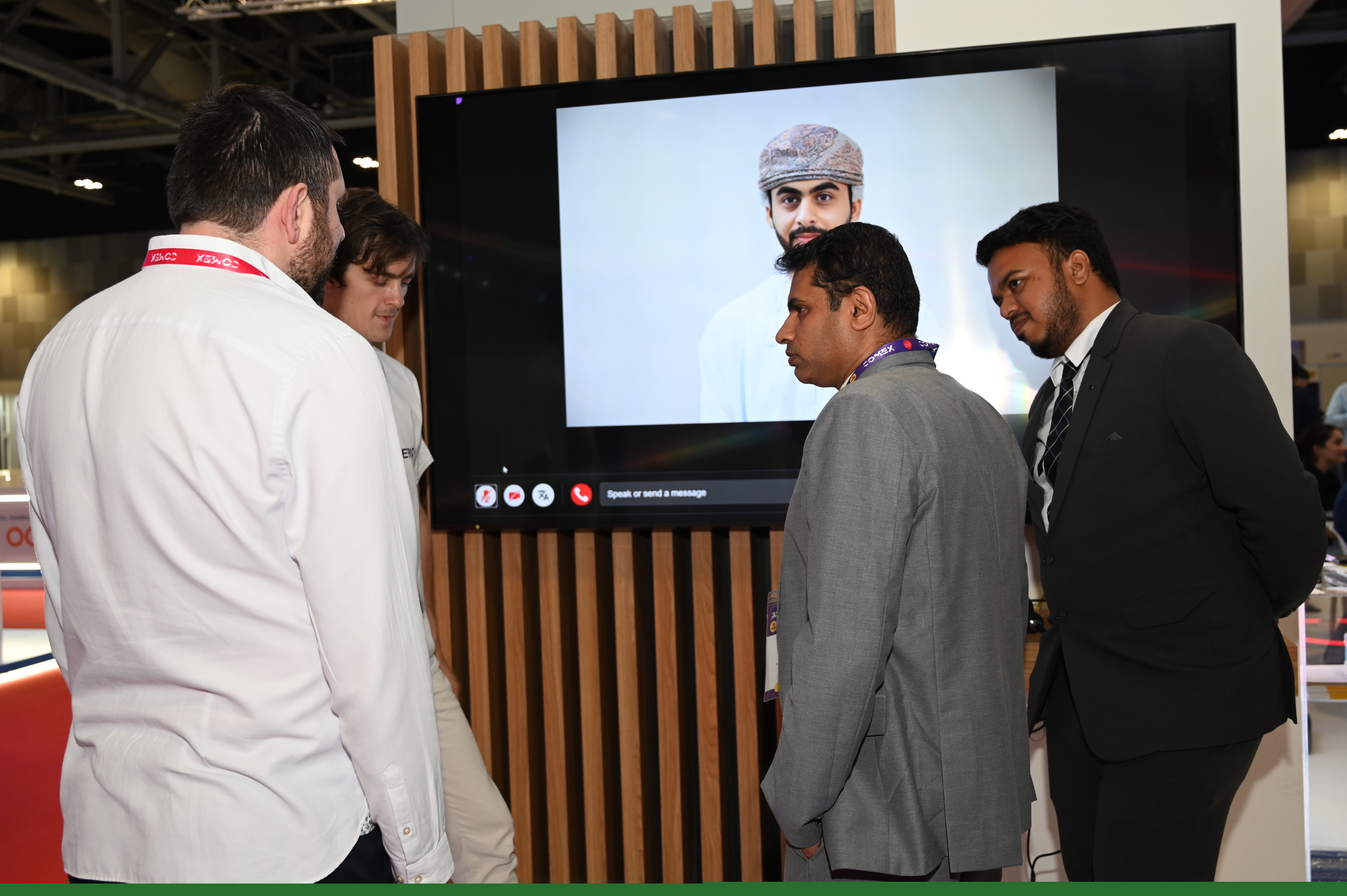 Visitors speaking with Omar, Yepic’s live AI avatar on the Microsoft COMEX stand