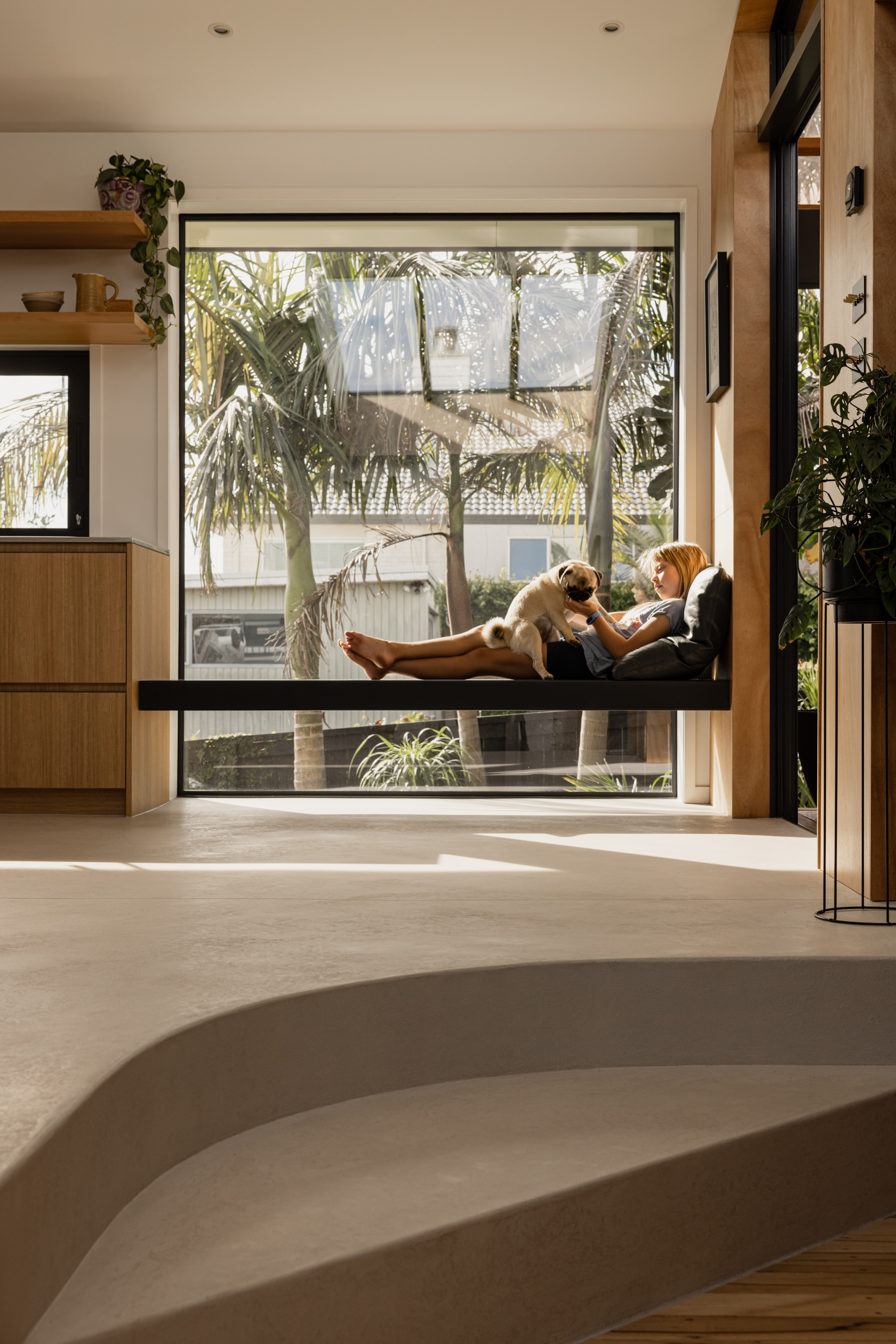 ata window seat with girl and her dog