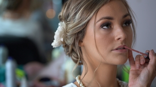 Bride having makeup done