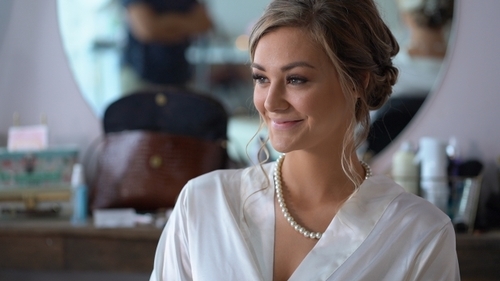 Bride getting ready in dressing room