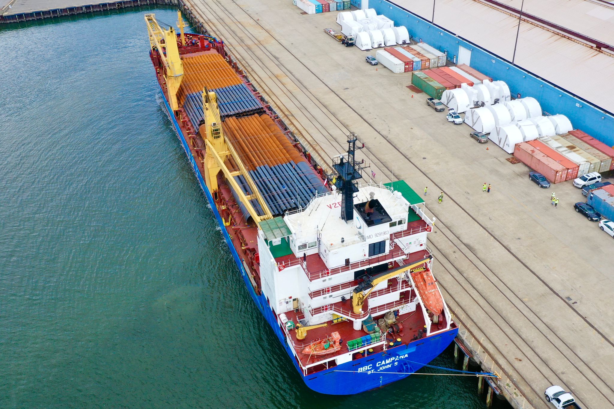This image shows a load of pipe being freighted at the Port of Houston and demonstrates 6Gen's industry of shipping steel logistics.