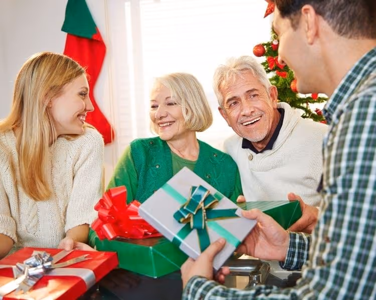 Family enjoying celebration around a Christmas tree
