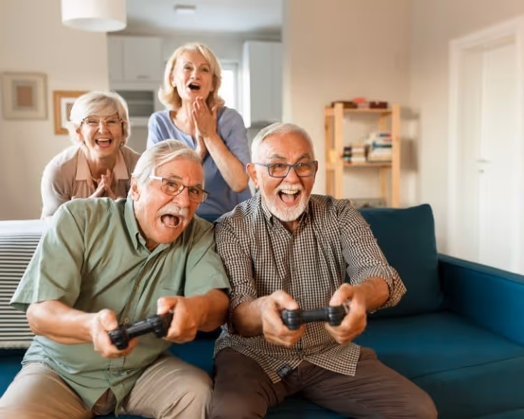 Four seniors playing video games