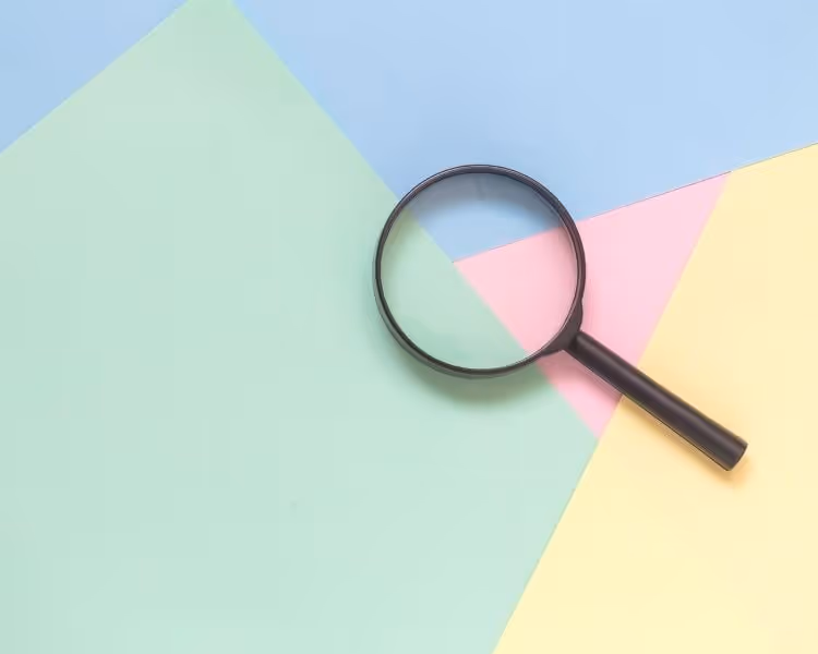 Magnifying glass on colorful background