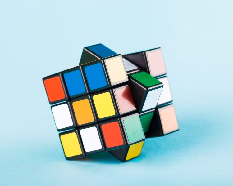 Rubik's cube on teal background