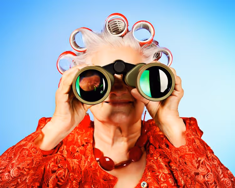 Senior looing through binoclars