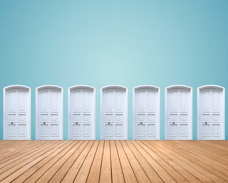 Many white doors on teal background