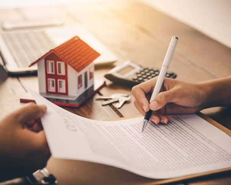 Signing paperwork for a home